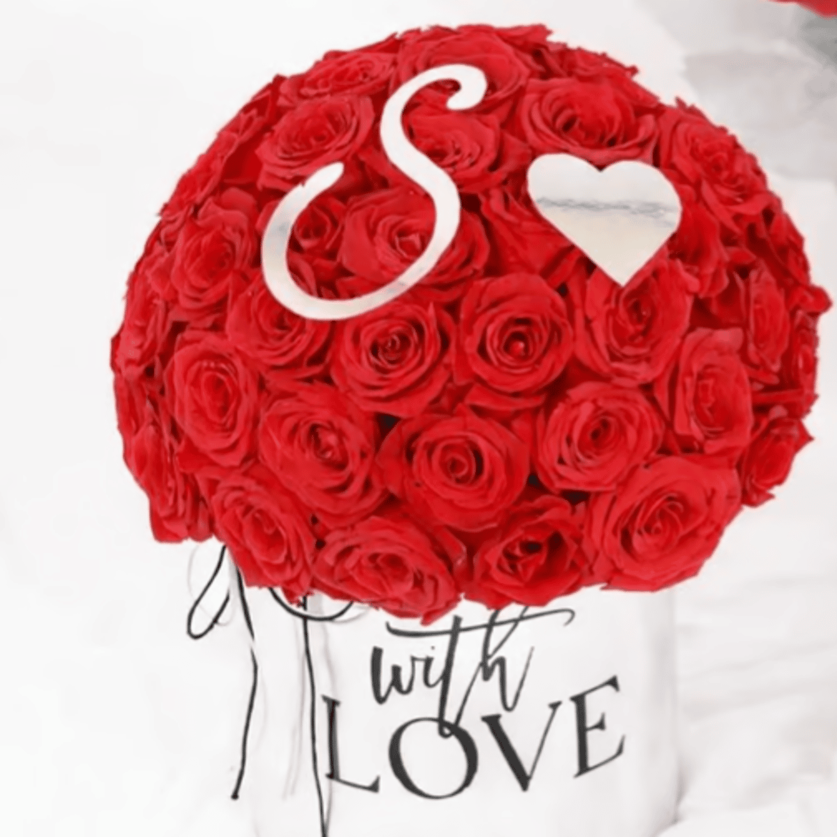 Silver Script Initial & Heart — silver script letter and heart placed among red roses